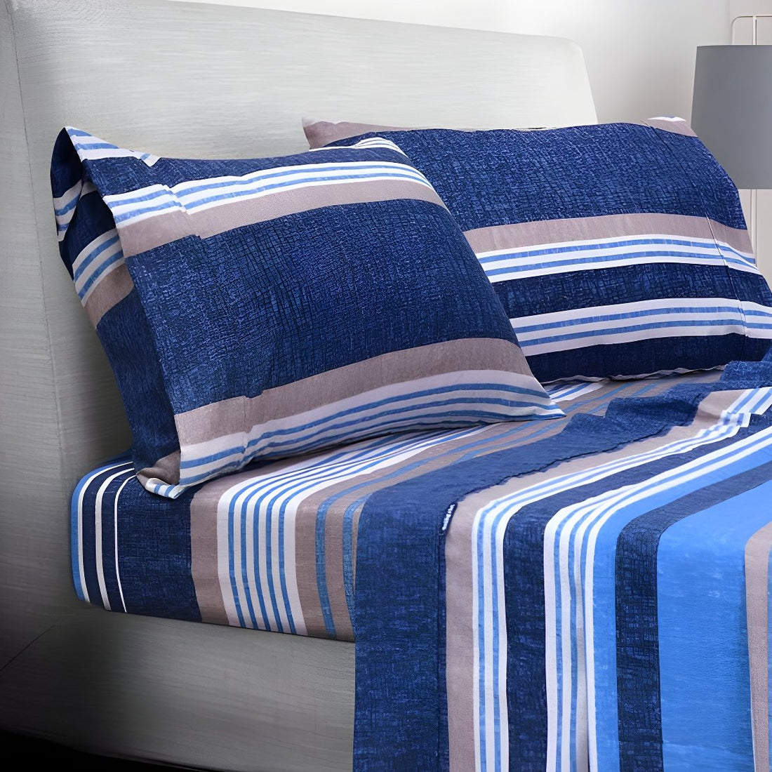Folded blue striped sheets stacked neatly