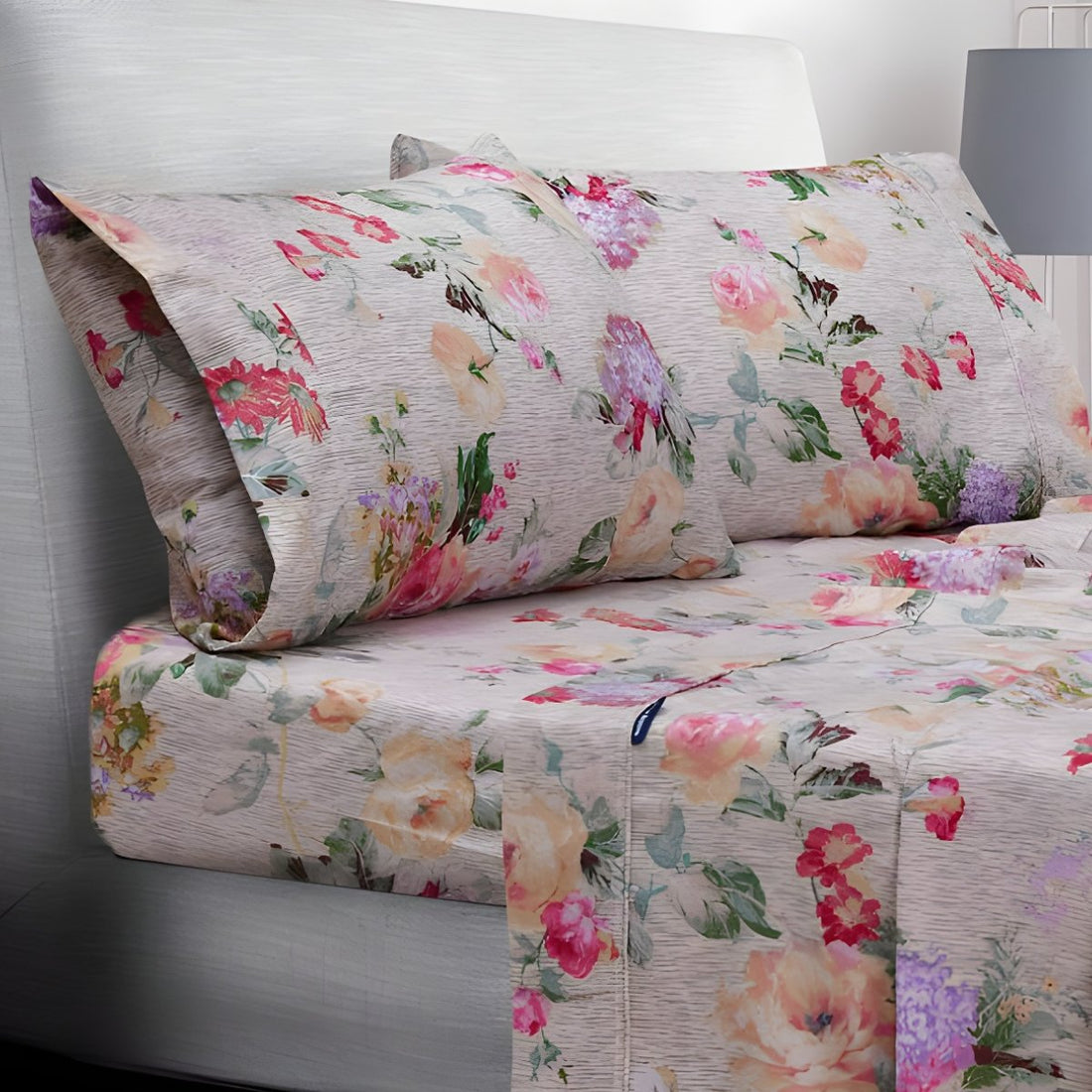Folded pastel floral sheets stacked neatly