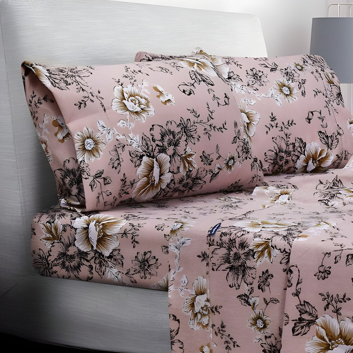 Folded pink floral sheets stacked neatly