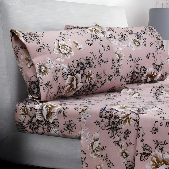 Folded pink floral sheets stacked neatly