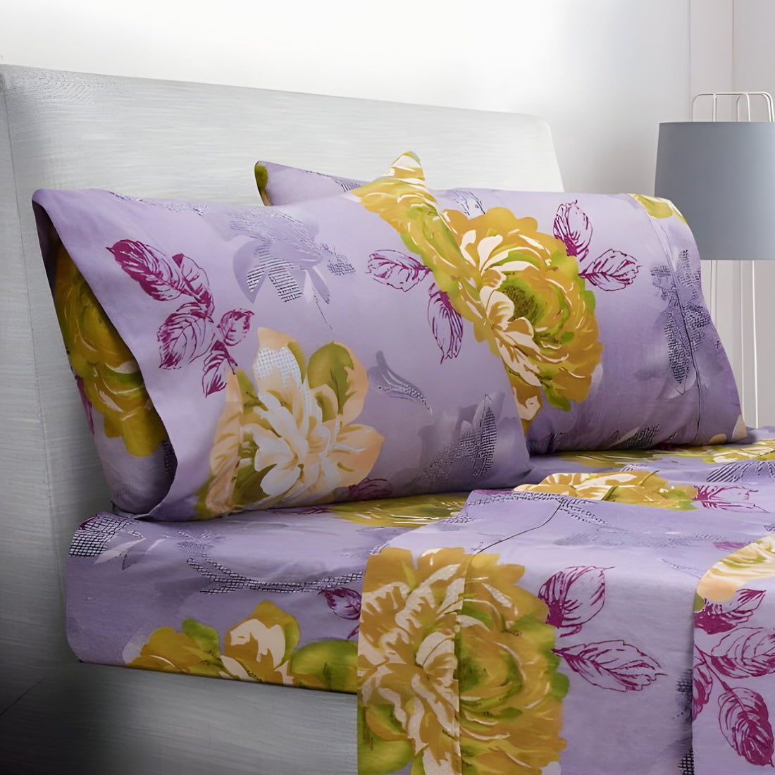 Folded purple floral sheets stacked neatly