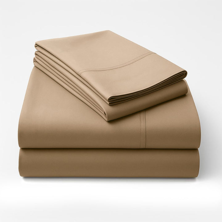 Folded tan cotton sheets stacked neatly