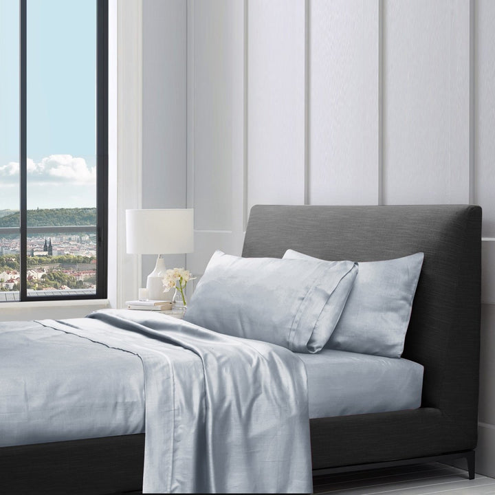 1200TC pure cotton sheet set in silver grey styled on a bed with pillows