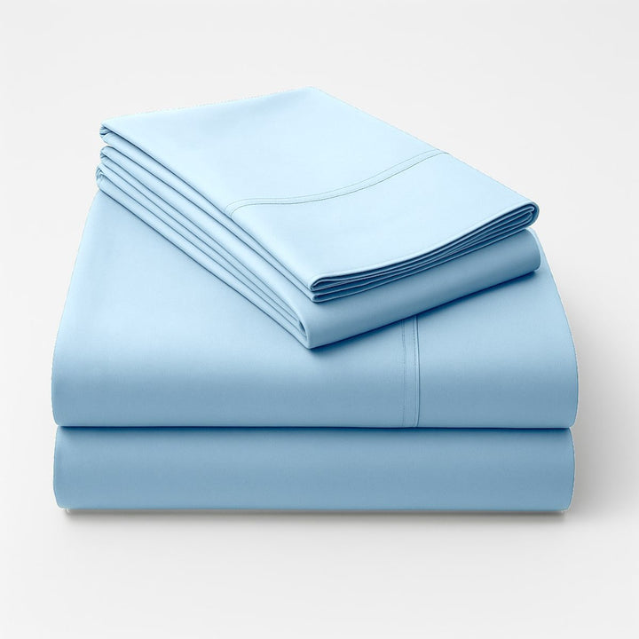 Folded blue cotton sheets stacked neatly