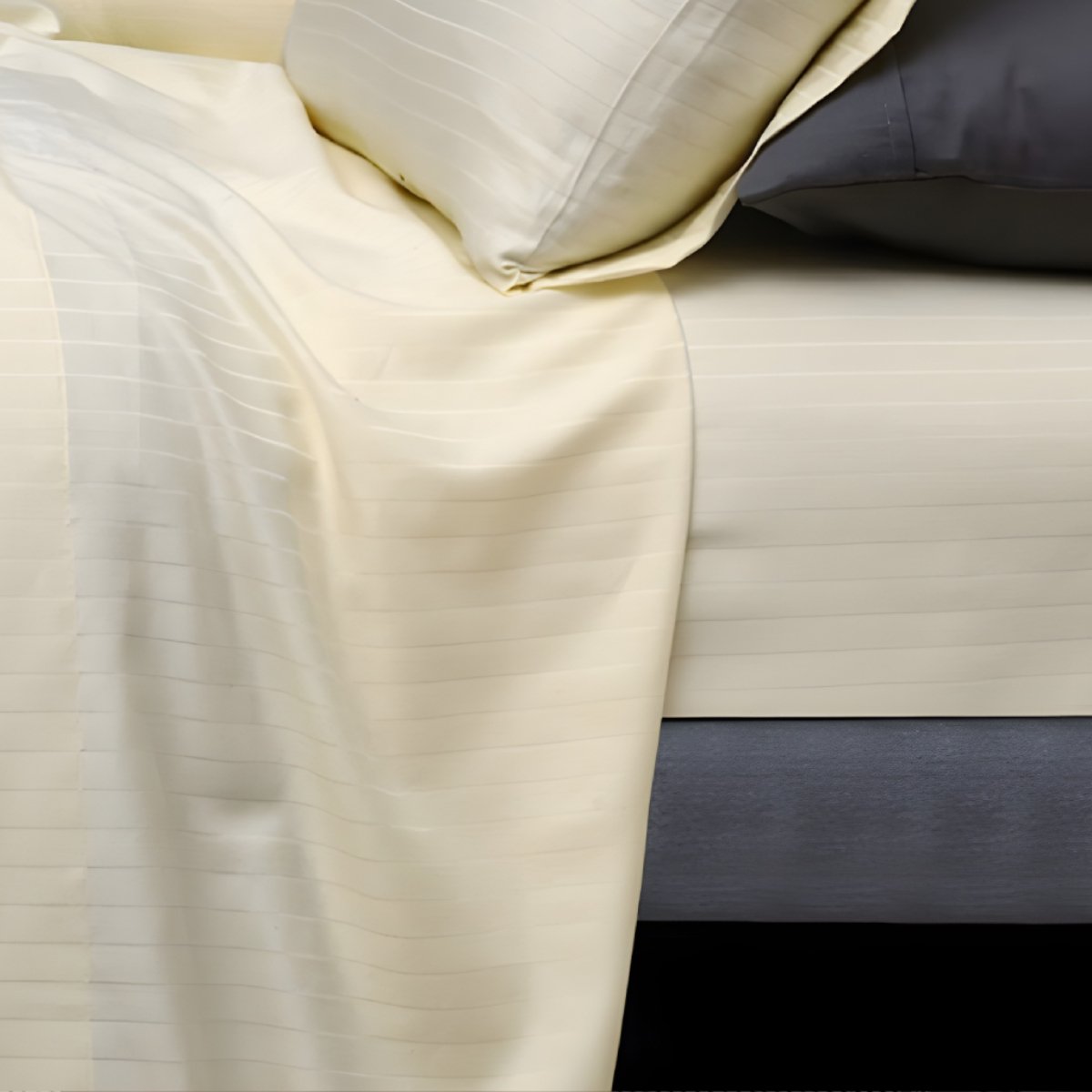 Folded ivory stripe sheets stacked neatly