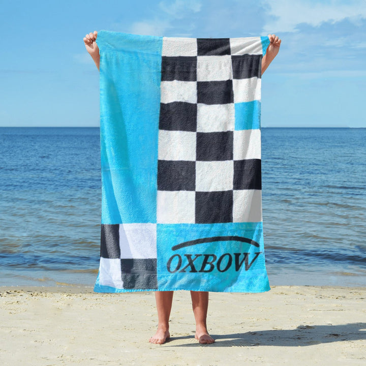 Blue black white towel beach sand